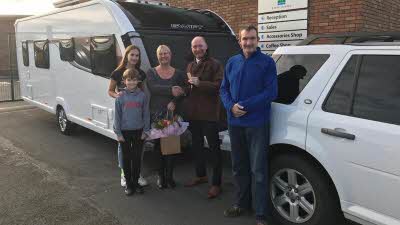 Sammy Faircloth and family are handed the keys to their new Swift Conqueror 565 caravan at Salop Leisure