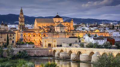Cordoba, Spain at the Roman Bridge and Mosque Cathedral on the Guadalquivir River