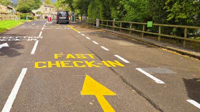 Entrance to Hawes Club Campsite showing the fast check-in lane with the barrier entrance 