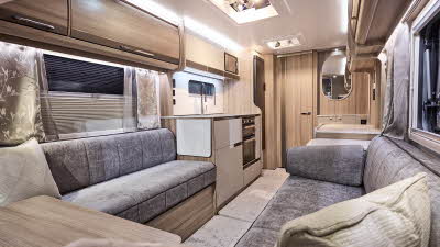 Interior of the Bailey Unicorn Deluxe Seville with grey sofas, cosy cushions and wood accents, large windows and two skylights will let natural light flood in.  Perfect for relaxation and designed for comfort.