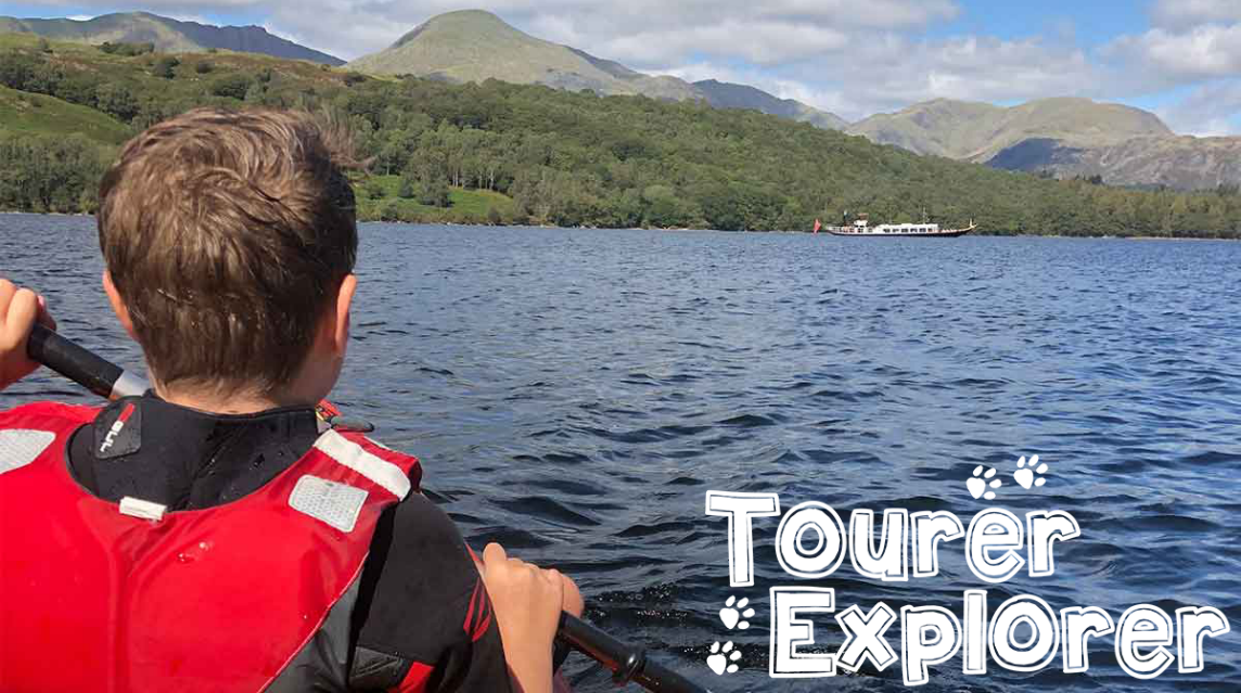 Boy kayaking on river with Tourer Explorer logo on bottom right hand side