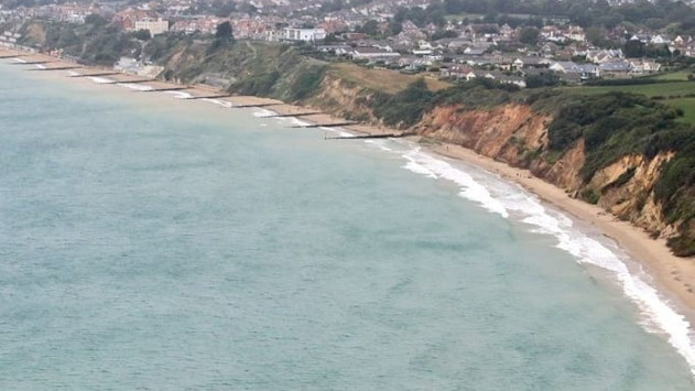 Overlooking the cliffs and groynes at sandy Swanage beach