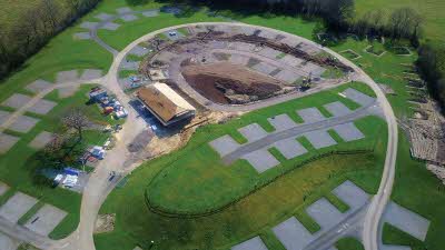 Aerial view of empty hardstanding campsite pitches