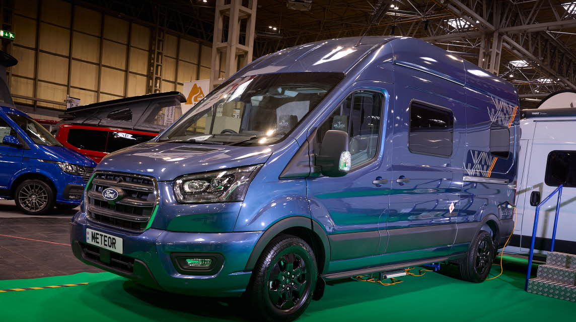 WildAx Motorhomes Meteor is blue with black trim.  There are white and orange decals.  