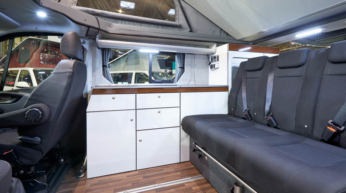 Interior, rising roof, grey upholstery, wooden floor