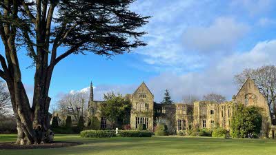 View of the house and trees at Nymans