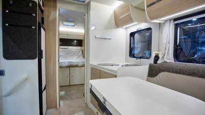 Cream interior, beige upholstery, wooden cabinets