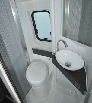 Toilet and sink with mirror
