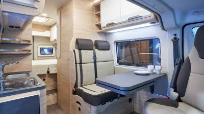 Biege upholstery, kitchen sink, rear bed, skylight