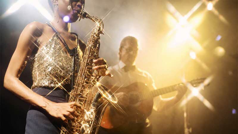  jazz duo playing on stage under the spotlight