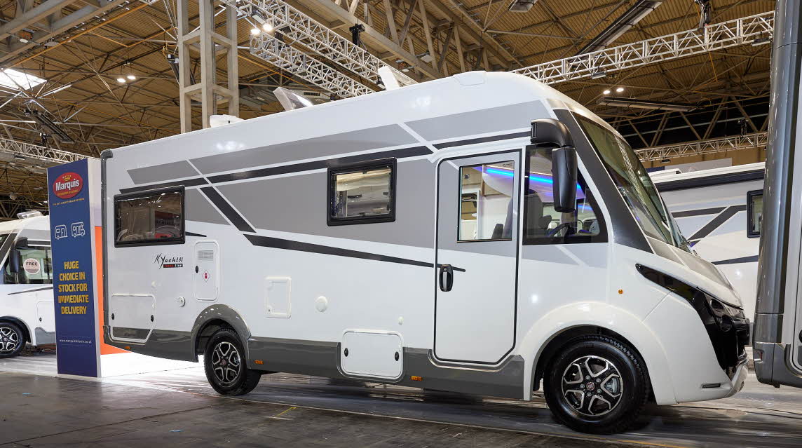 Mobilvetta Tekno Line K-Yacht 95 has a predominately white exterior with grey graphics. The wheels are black alloys.