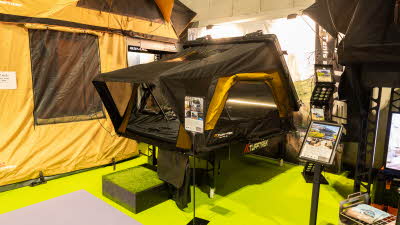 The TUFFTREK® Sahara-X Hybrid Roof Tent has yellow and black canvas, its hard shell roof is black.  The door and windows open fully as shown.