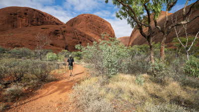 man walking through a gorge in Kata Tjuta National Park