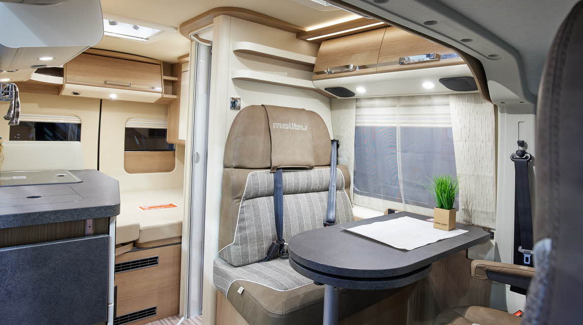 Van conversion, grey table, beige/patterned exterior