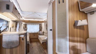 Eriba Touring 540 interior, beige/wood interior, rear lounge, kitchen, front lounge, pop top roof.