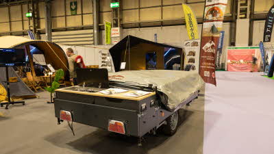 The Cabanon Malawi 2.0 is shown folded.  The hob in the rear kitchen has its cover lifted. 