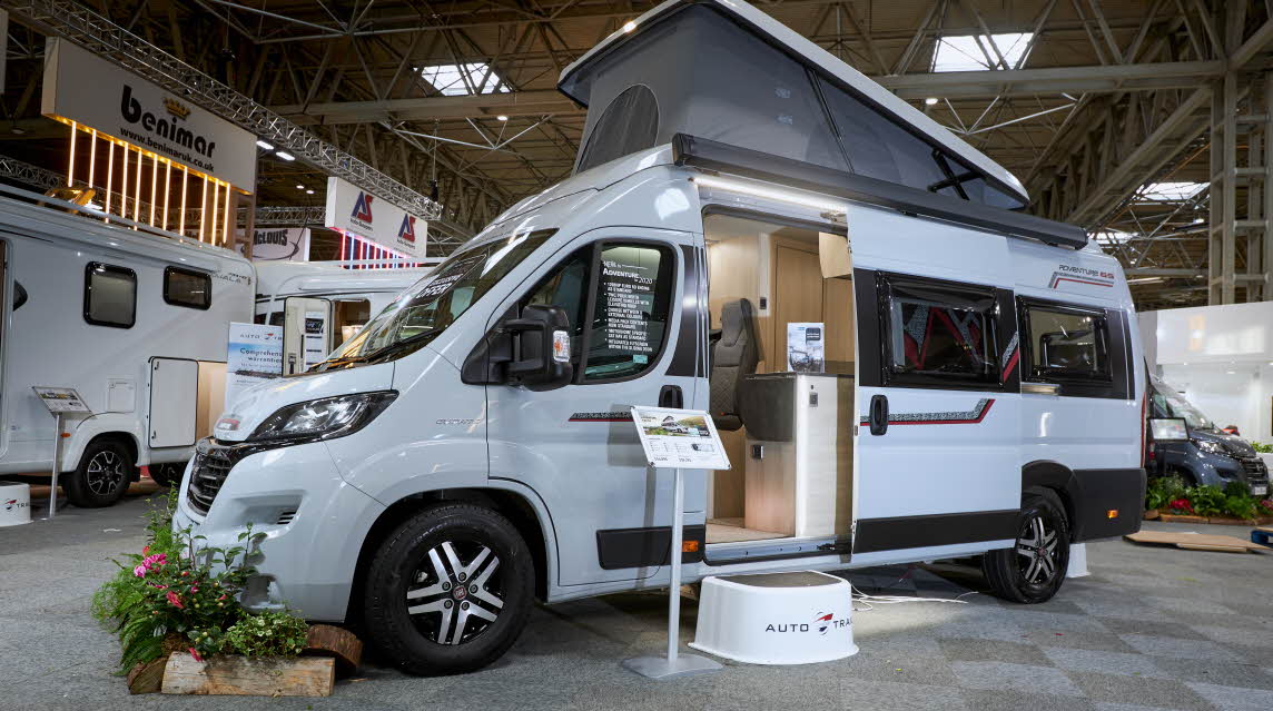 Exterior, rising roof, white van conversion.