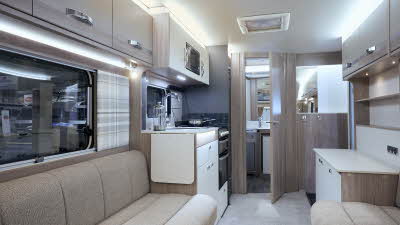 Swift Challenger 480 SE interior, beige upholstery, wood furniture, lounge, kitchen, end washroom, skylight
