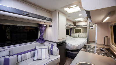 Interior, cream sofa, purple accents in upholstery
