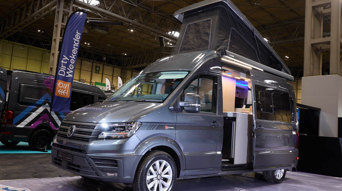 The Bespoke Campers Edition (Four Berth) is grey.  The habitation sliding door is open which reveals the interior.  The pop top roof is fully open.