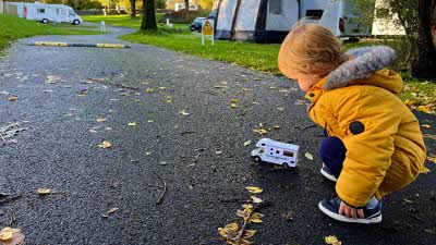 Boy with his toy motorhome at Meatfell Hop Club campsite