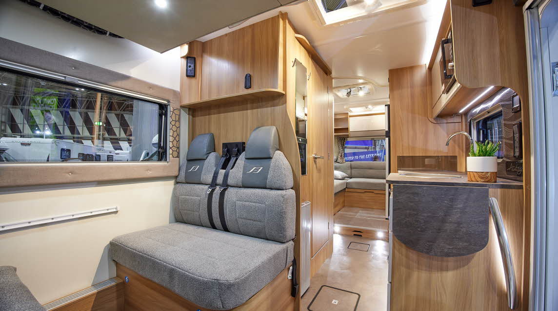 Grey upholstery, wooden furniture, skylight