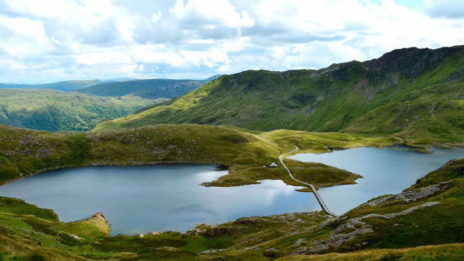 Lake surrounded by verdant hills