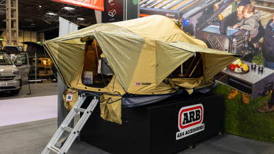 The ARB Flinders has yellow canvas and has a silver ladder to gain access.  It was a large doorway and a window which is held open by poles.