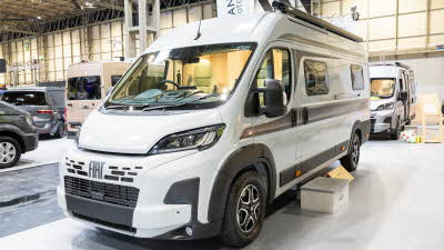 The Vantage NEO is white with black decals.  There is step to gain easy access.