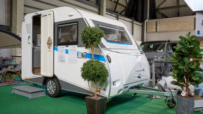Campmaster King exterior, white caravan with grey/blue decals, single axle