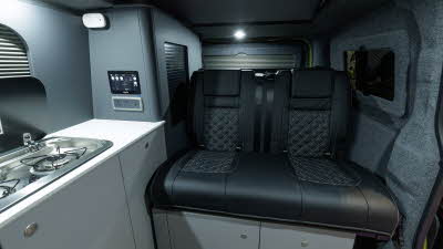 The Bespoke Explore has black upholstery with grey walls and white cabinets.