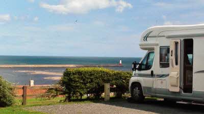Motorhome parked, looking out at a seaview