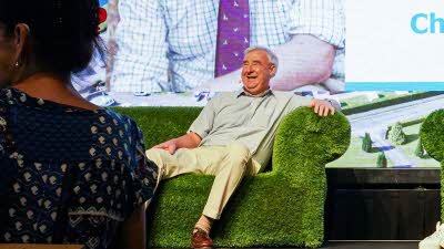 Yorkshire Vet Peter Wright is seen onstage on a green sofa smiling