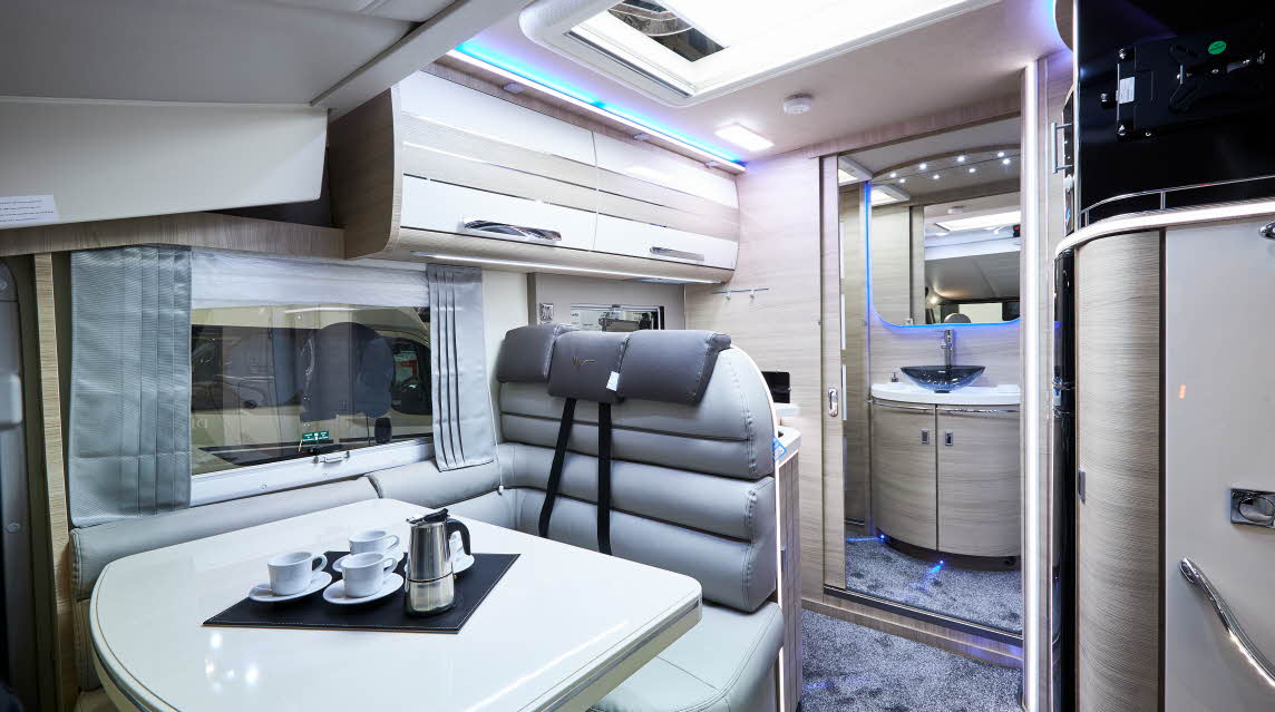 Grey upholstery, cream furniture, purple accent lighting