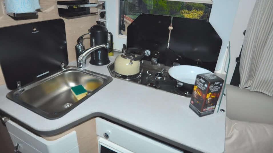 Motorhome kitchen with three ring hob and sink