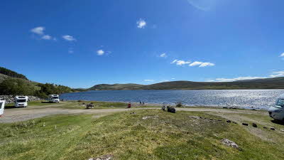 Blue skies over the water at Altnaharra