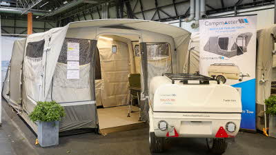 Campmaster AIR 1000 LX exterior, brown and cream canvas with the door open showing into the interior.  The travelling trailer is shown in cream