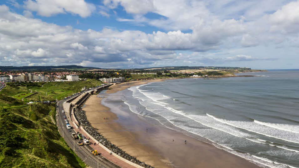 Sandy beaches and waves at North Bay Beach in Scarborough, North Yorkshire