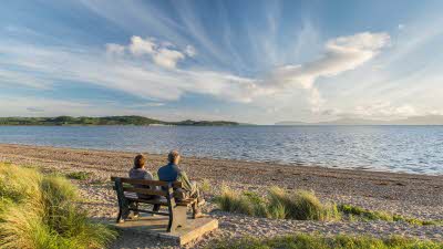 Couple looking out over water