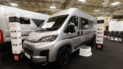 The Auto-Trail Expedition 68 XL Flex is silver and has a step outside the closed sliding door to gain easy access (when open).  There is an information panel towards the rear.