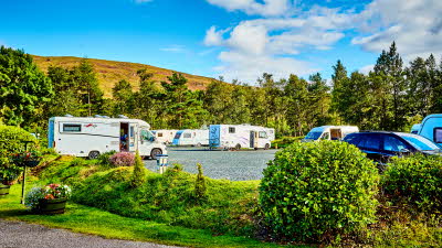 Caravans and motorhomes pitched up at a campsite
