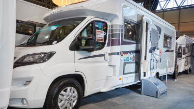 Close up view of a white motorhome in an exhibition centre
