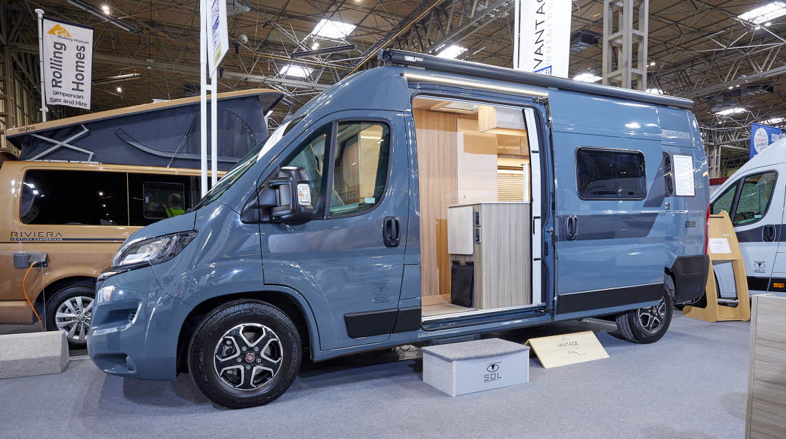 Vantage SOL has a grey exterior.  The sliding door is open showing the interior, there is a step to gain easy access.  