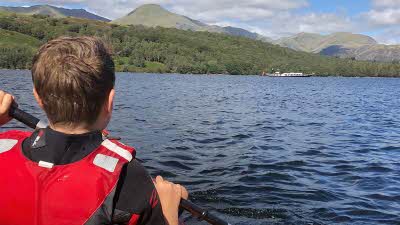 Child kayaking on Coniston Water, Lake District