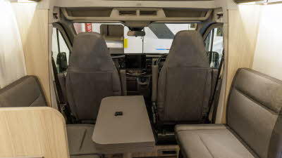 The Sun Living C Series 70 DL has brown upholstery and in the middle of the two sofas there is a table which can be extended, it is shown folded.