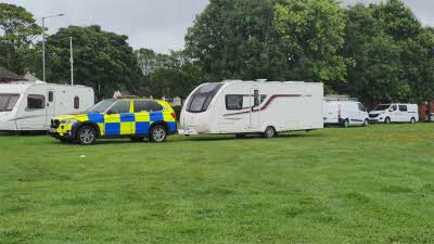 Stolen caravan being towed by police escort