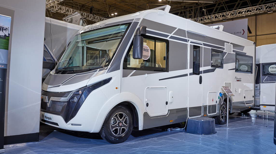 Mobilvetta Tekno Line K-Yacht 95 has a predominately white exterior with grey graphics. There is a large step by the habitation door to gain easy access. The wheels are black alloys.