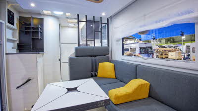 White interior, grey upholstery, yellow cushions