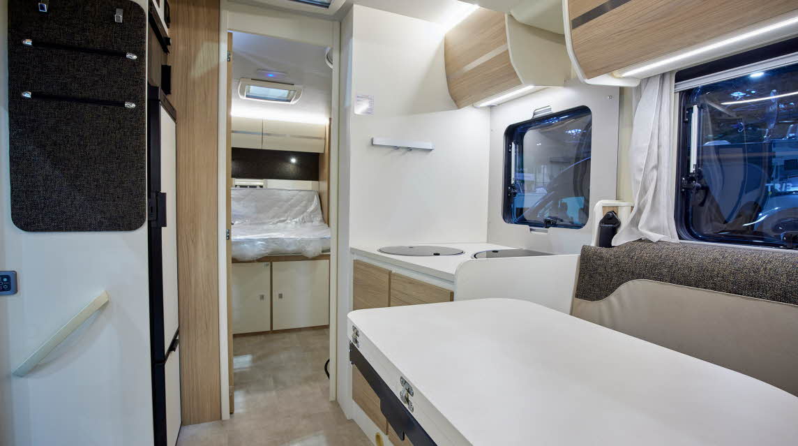 Cream interior, beige upholstery, wooden cabinets