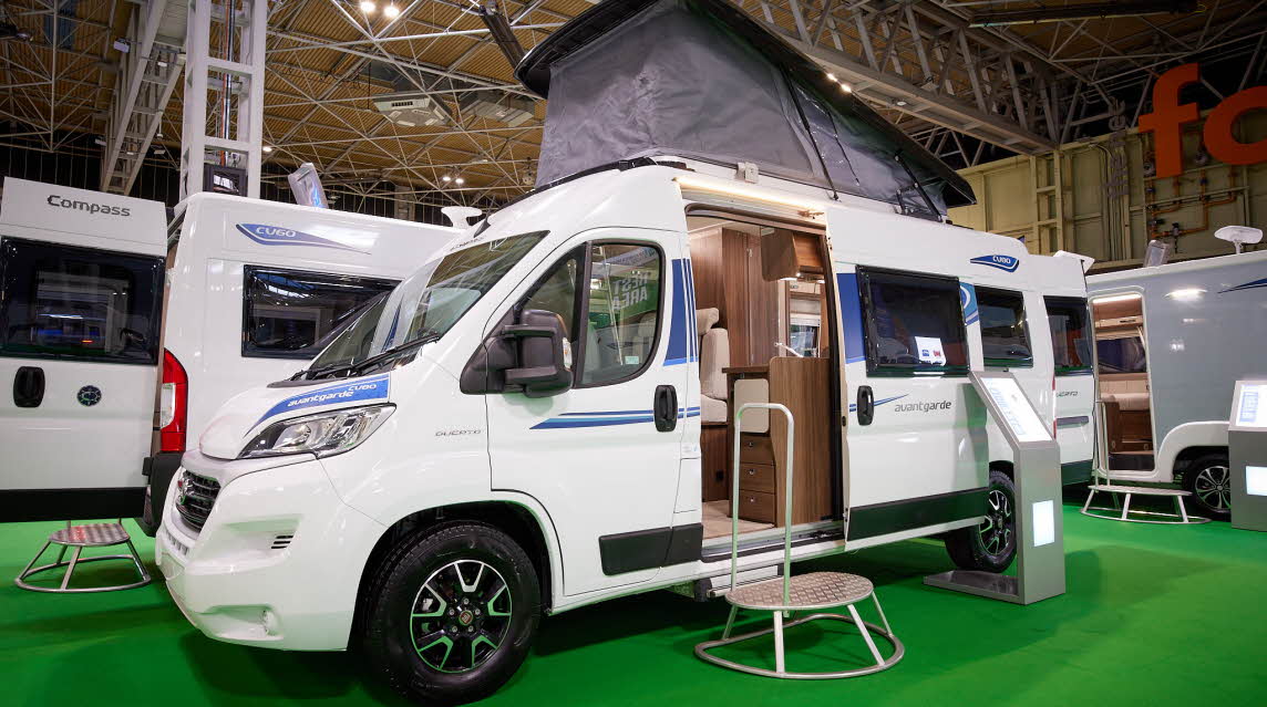 Van Conversion exterior, white, rising roof